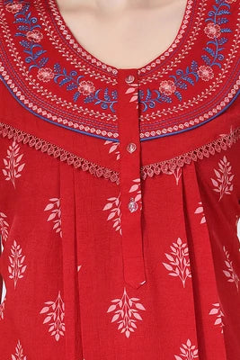 Close up of embroidered neckline on red night gown
